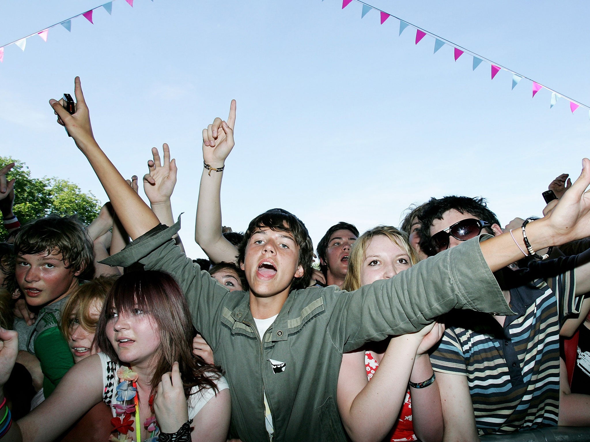 Festival-goers watch the BBC Radio One/Undersage Stage at 'Underage', a festival for under 18-year-olds, at Victoria Park on August 10, 2007 in London, England.