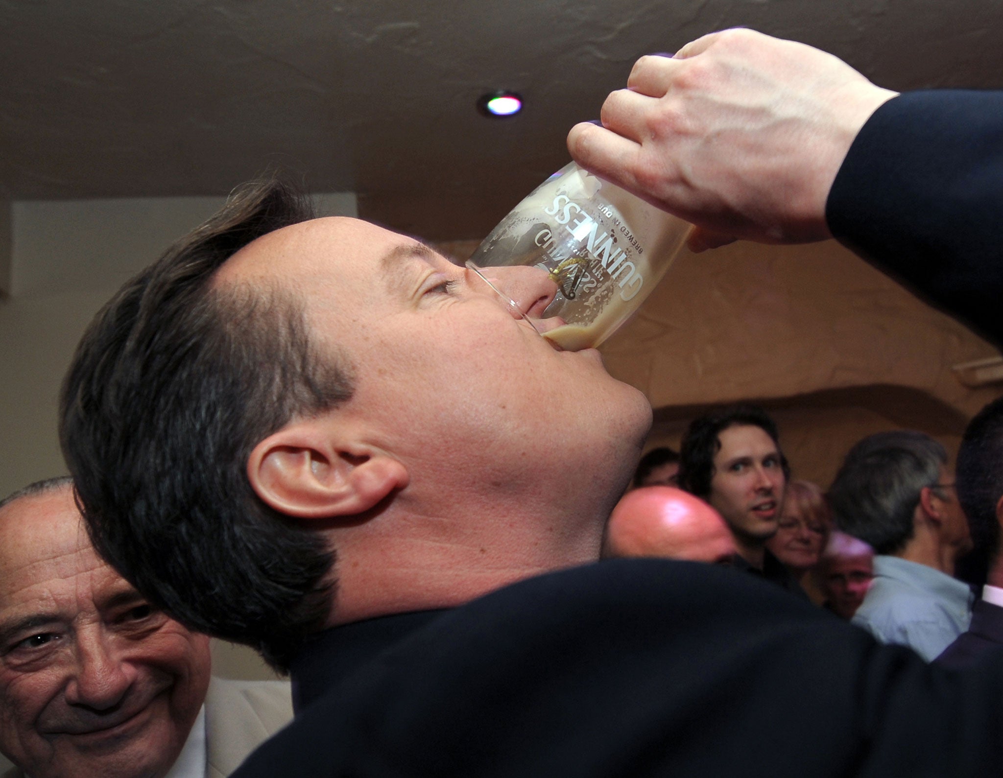 Cameron drains a pint after the second televised debate in 2010