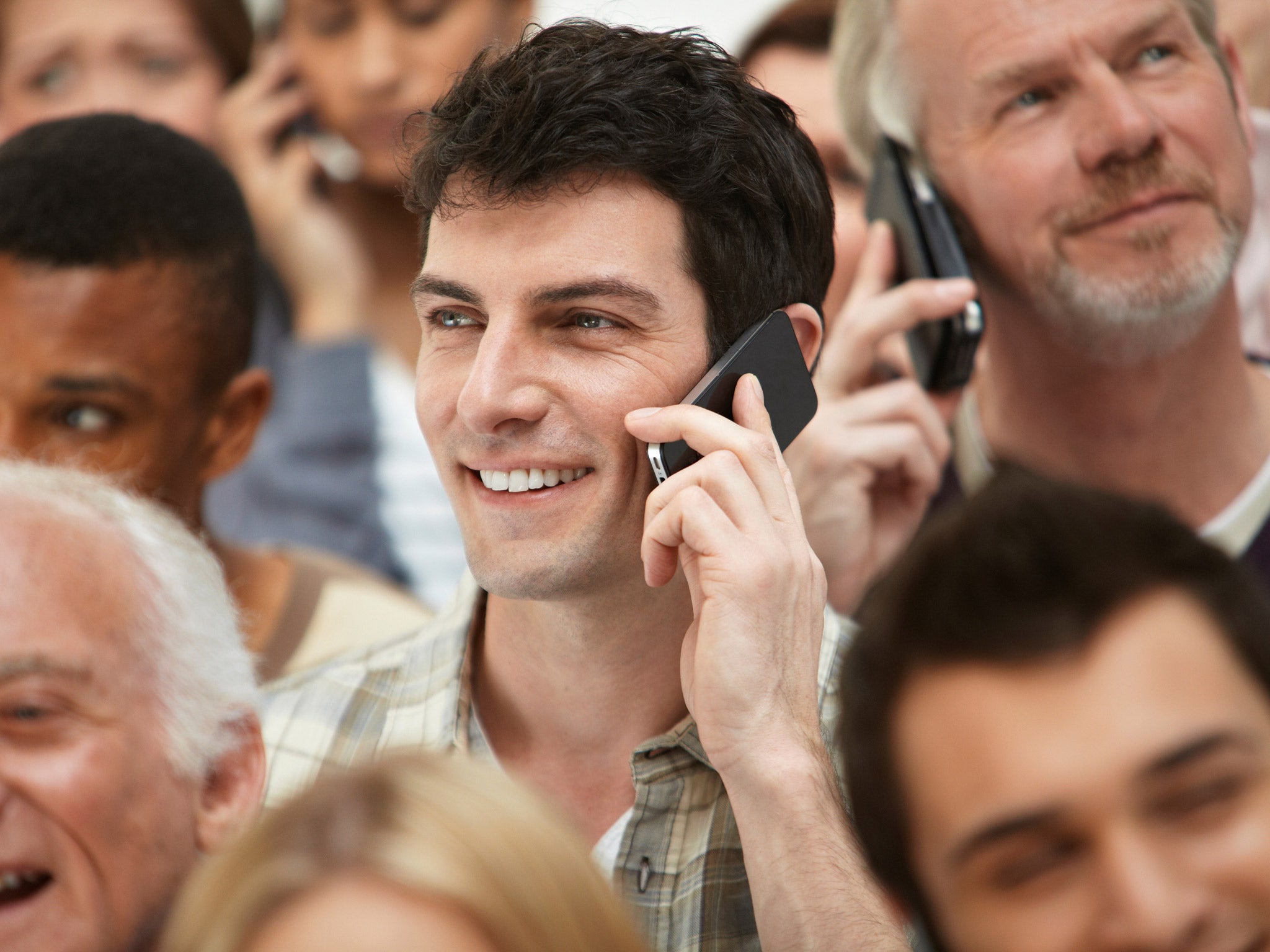 Image result for pictures people at dinner talking on cell phones