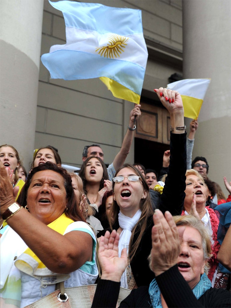 Argentine faithful celebrate outside a cathedral in Buenos Aires