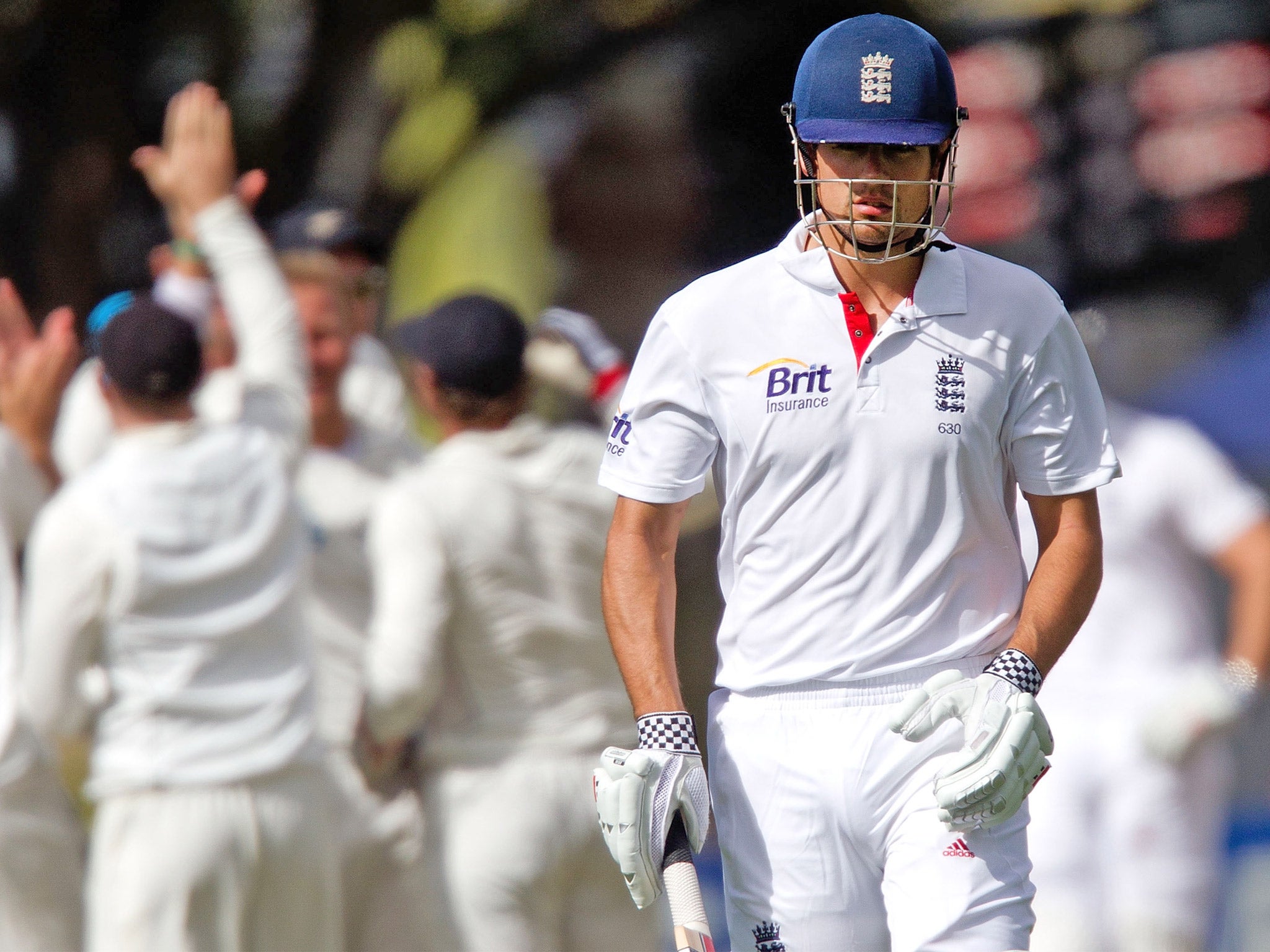 England's captain Alastair Cook walks from the field after being caught out