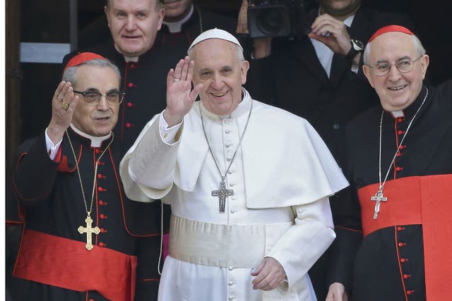 Newly elected Pope Francis, Cardinal Jorge Mario Bergoglio of Argentina waves from the steps of the Santa Maria Maggiore Basilica in Rome