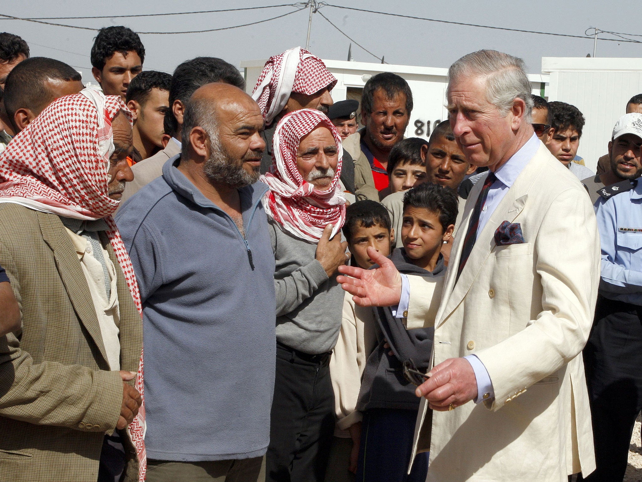 Prince Charles, Prince of Wales visits the King Abdullah Refugee Camp for Syrian refugees 2 kilometers from the Syrian border on the third day of a visit to the country on March 13, 2013 in Ramtha Jordan.