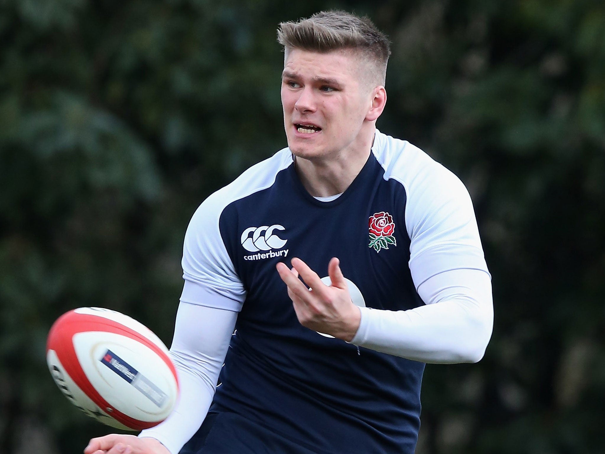 Owen Farrell passes the ball during England training at Pennyhill Park