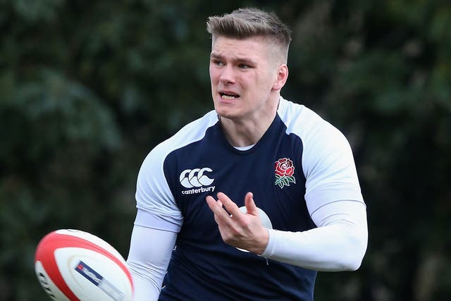 Owen Farrell passes the ball during England training at Pennyhill Park 