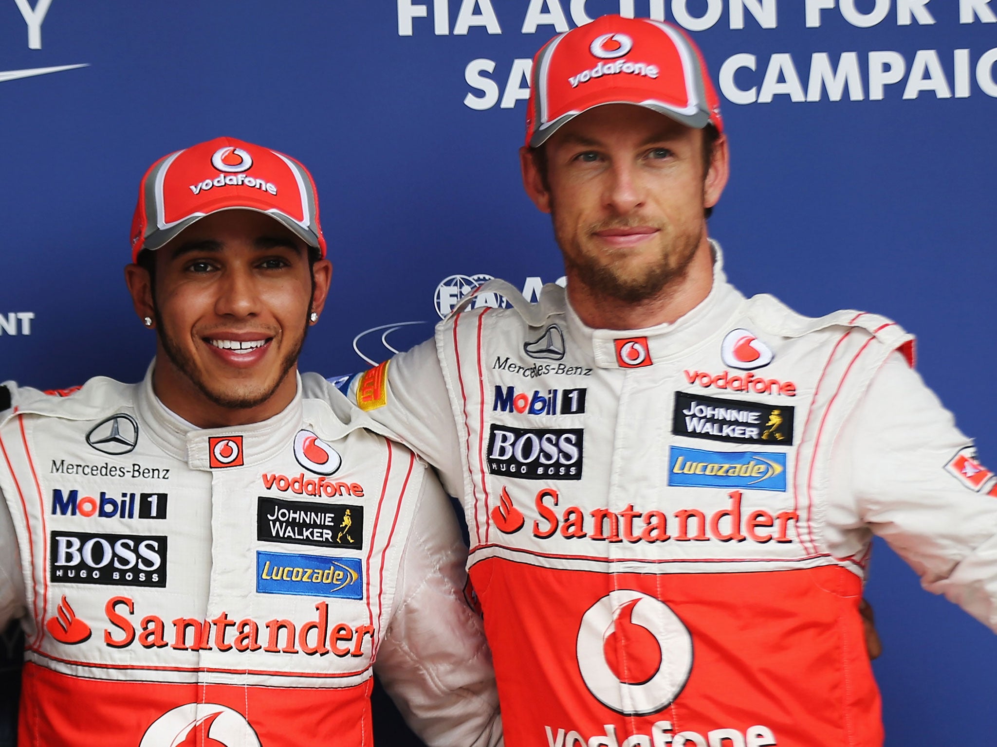 Happier times: Button (r) says Hamilton's comments about McLaren are wrong