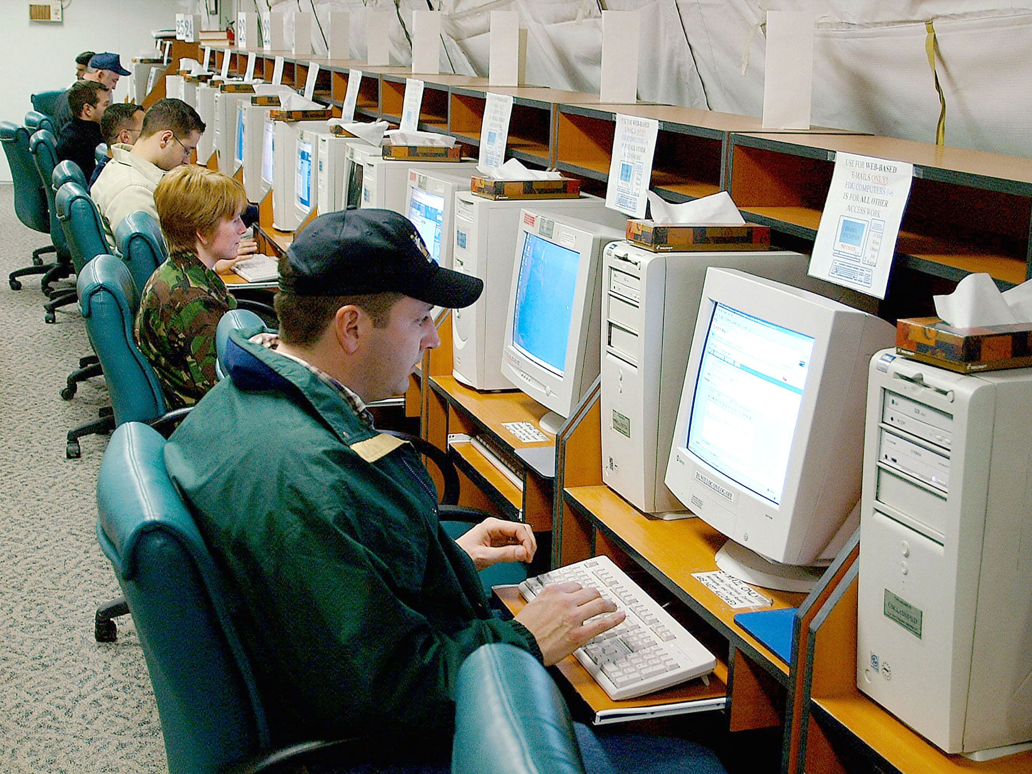 American military personnel deployed in support of Operation Northern Watch send emails in the morale tent at Hodja Village February 3, 2002 at Incirlik Air Base, Turkey.