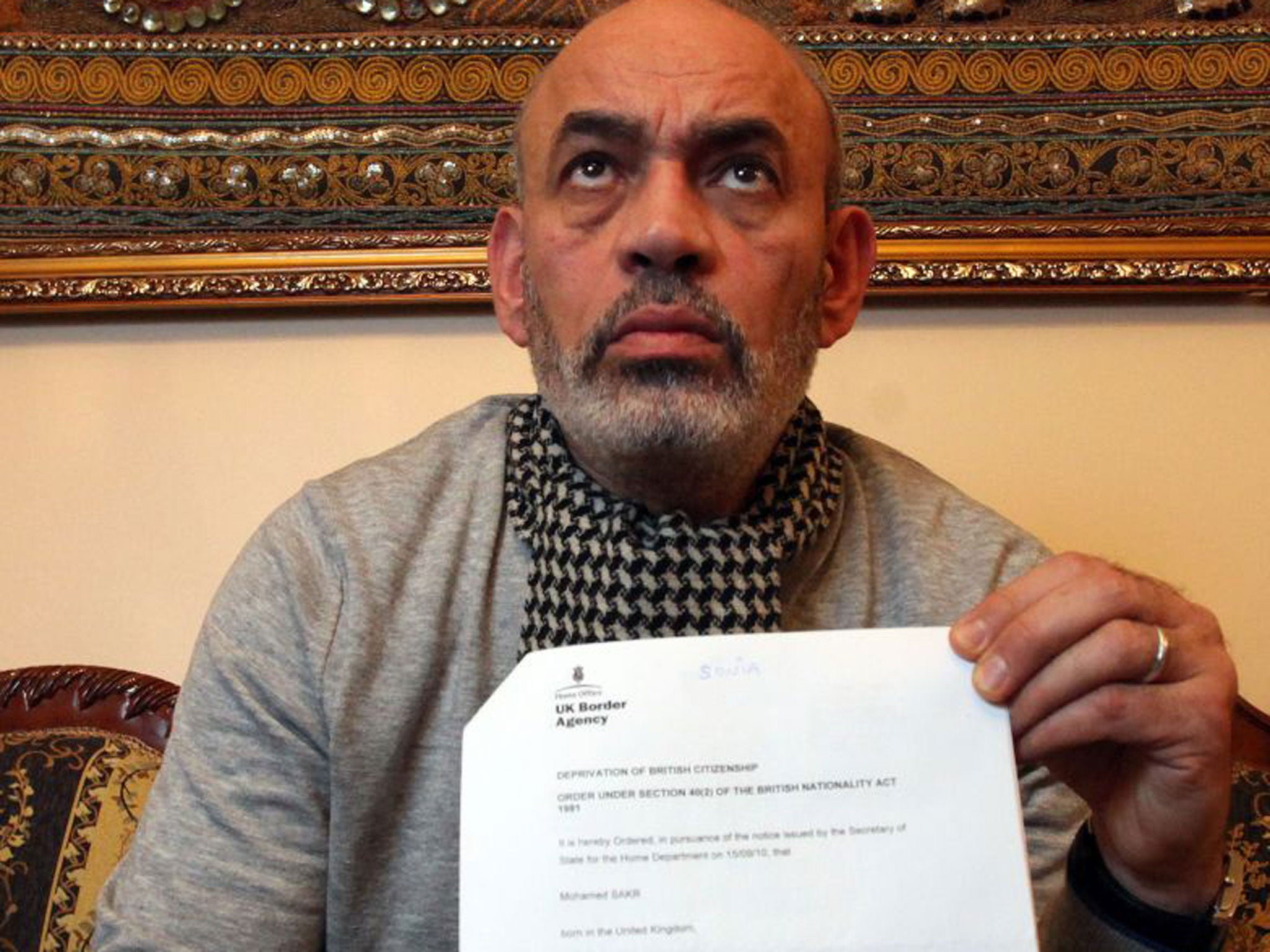 Gamal Sakr with the letter saying his son, Mohamed, had been stripped of his British citizenship