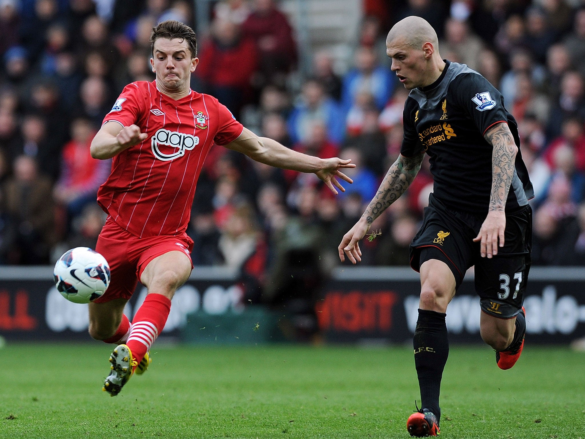 Martin Skrtel of Liverpool competes with Jay Ramirez of Southampton