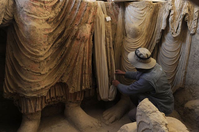 Under threat: An archaeologist studies Buddhas at Mes Aynak