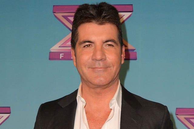 Simon Cowell is set to be a father, according to reports