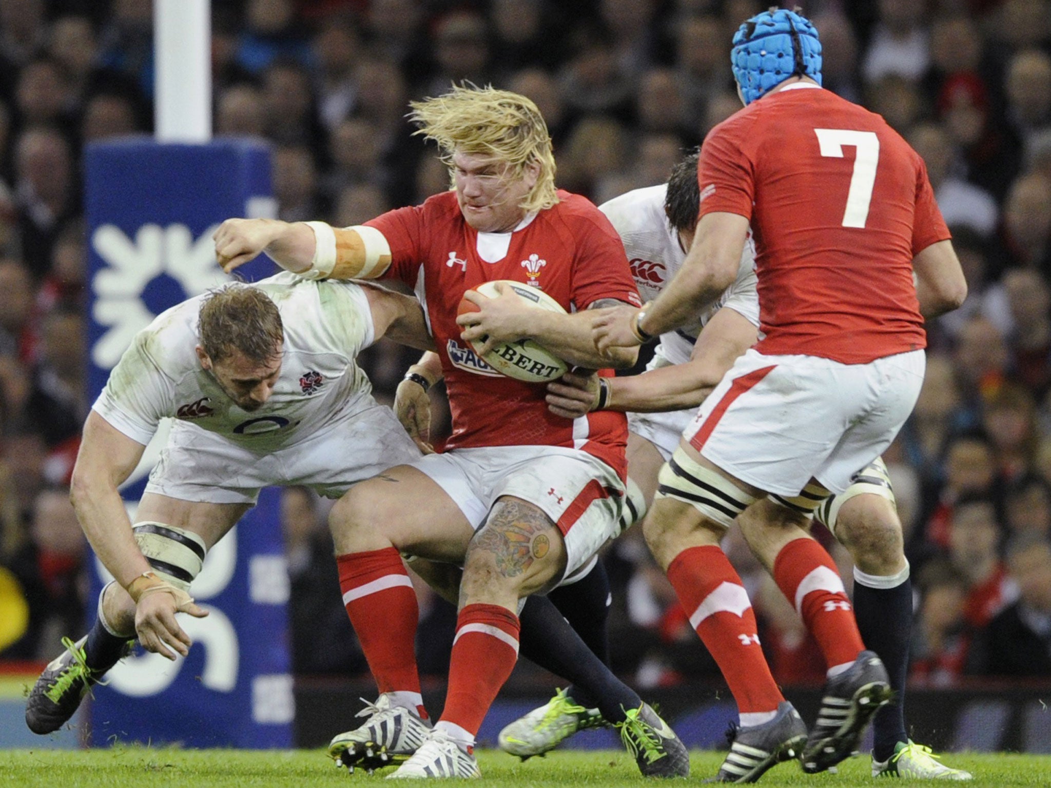 Captain crunch: Chris Robshaw (left) leads by example with a tackle on the Wales hooker Richard Hibbard