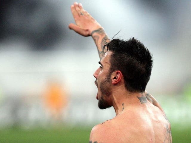 AEK Athens midfielder Giorgos Katidis celebrates by giving the Nazi salute to spectators after scoring the winning goal in his team's 2-1 Super League victory over Veria