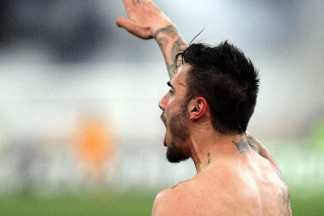 AEK Athens midfielder Giorgos Katidis celebrates by giving the Nazi salute to spectators after scoring the winning goal in his team's 2-1 Super League victory over Veria