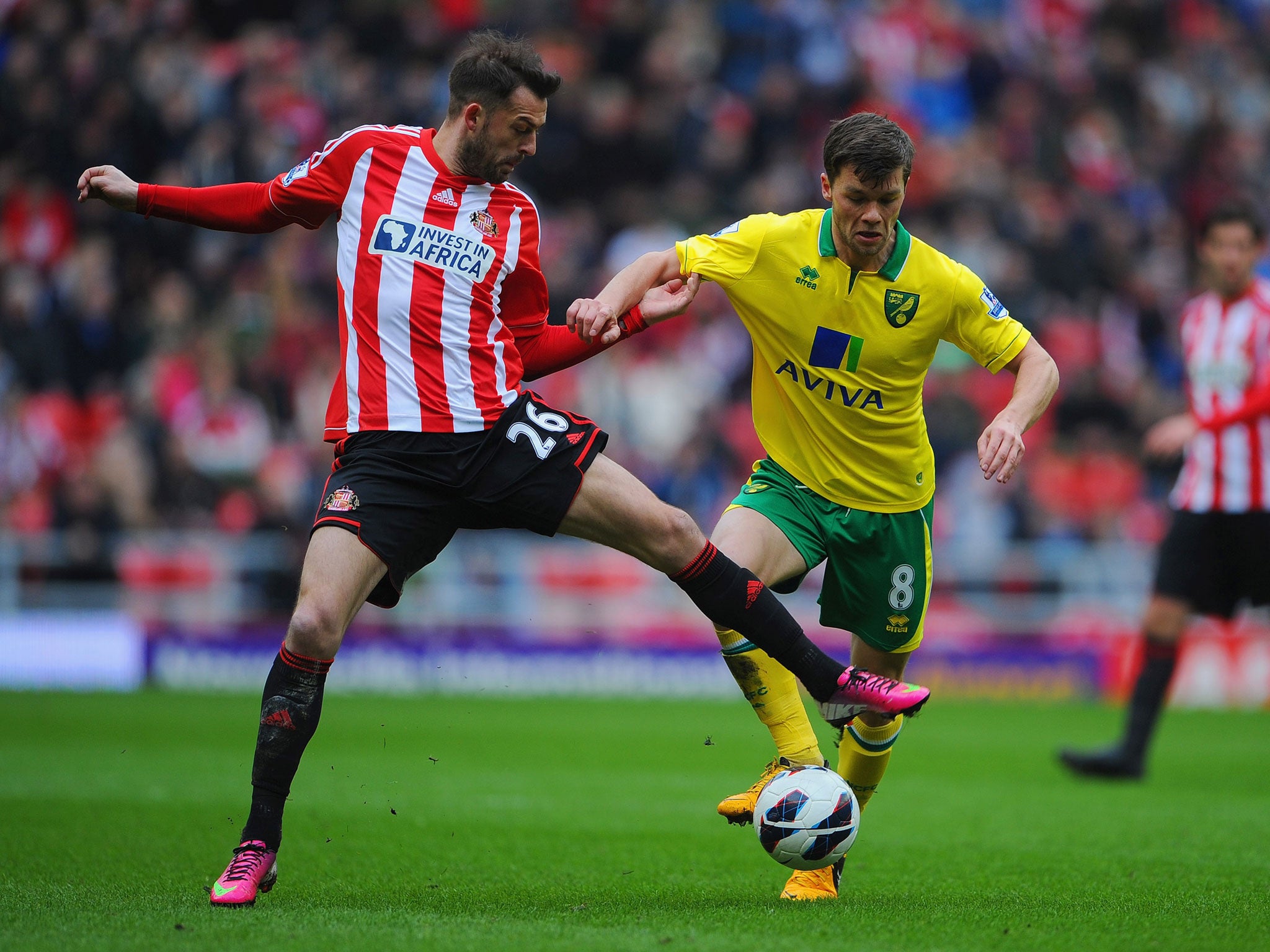 Steven Fletcher of Sunderland in action with Jonathan Howson of Norwich
