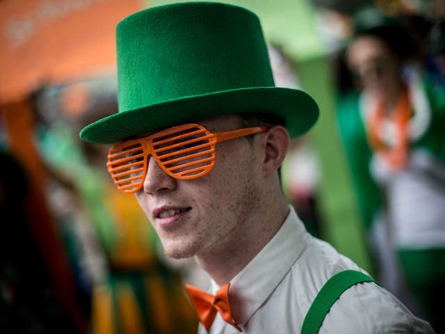 A man dressed in costume waits for the parade to start during the Singapore St Patricks Day 3-day long street Festival