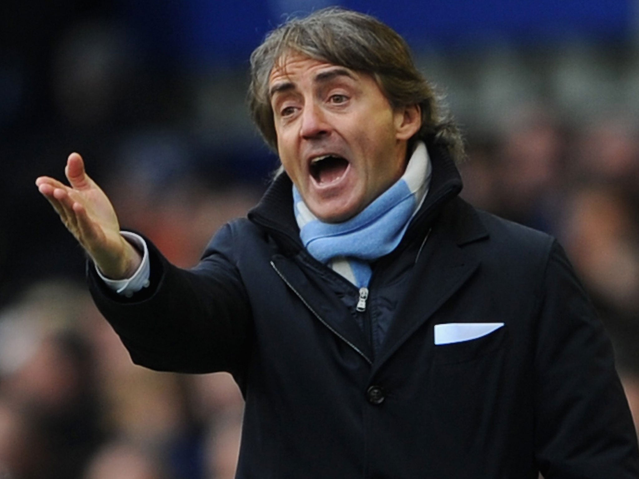Roberto Mancini gesticulates at his players during their defeat by Everton