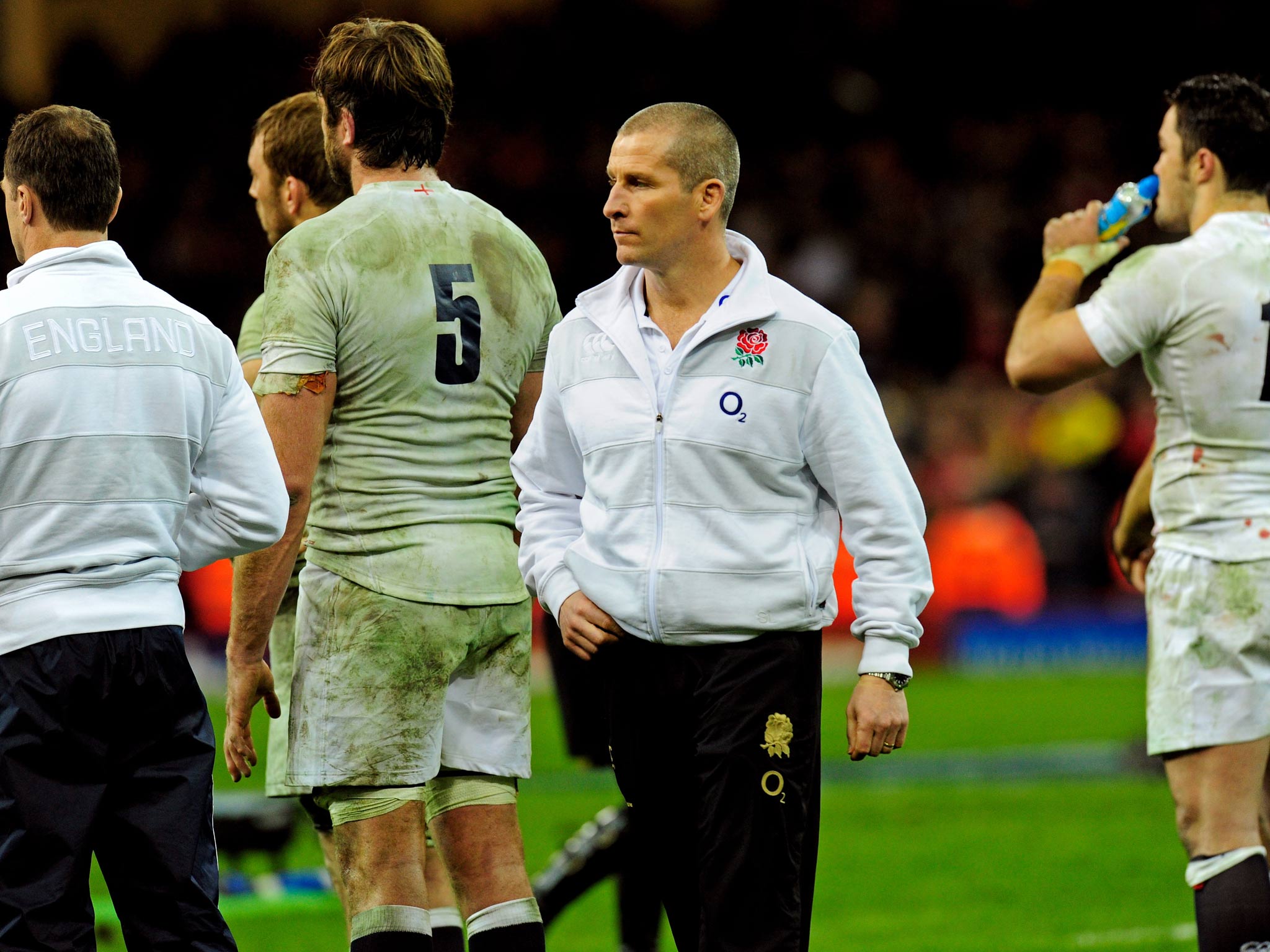 Dejected England head coach Stuart Lancaster looks on following his team's defeat to Wales
