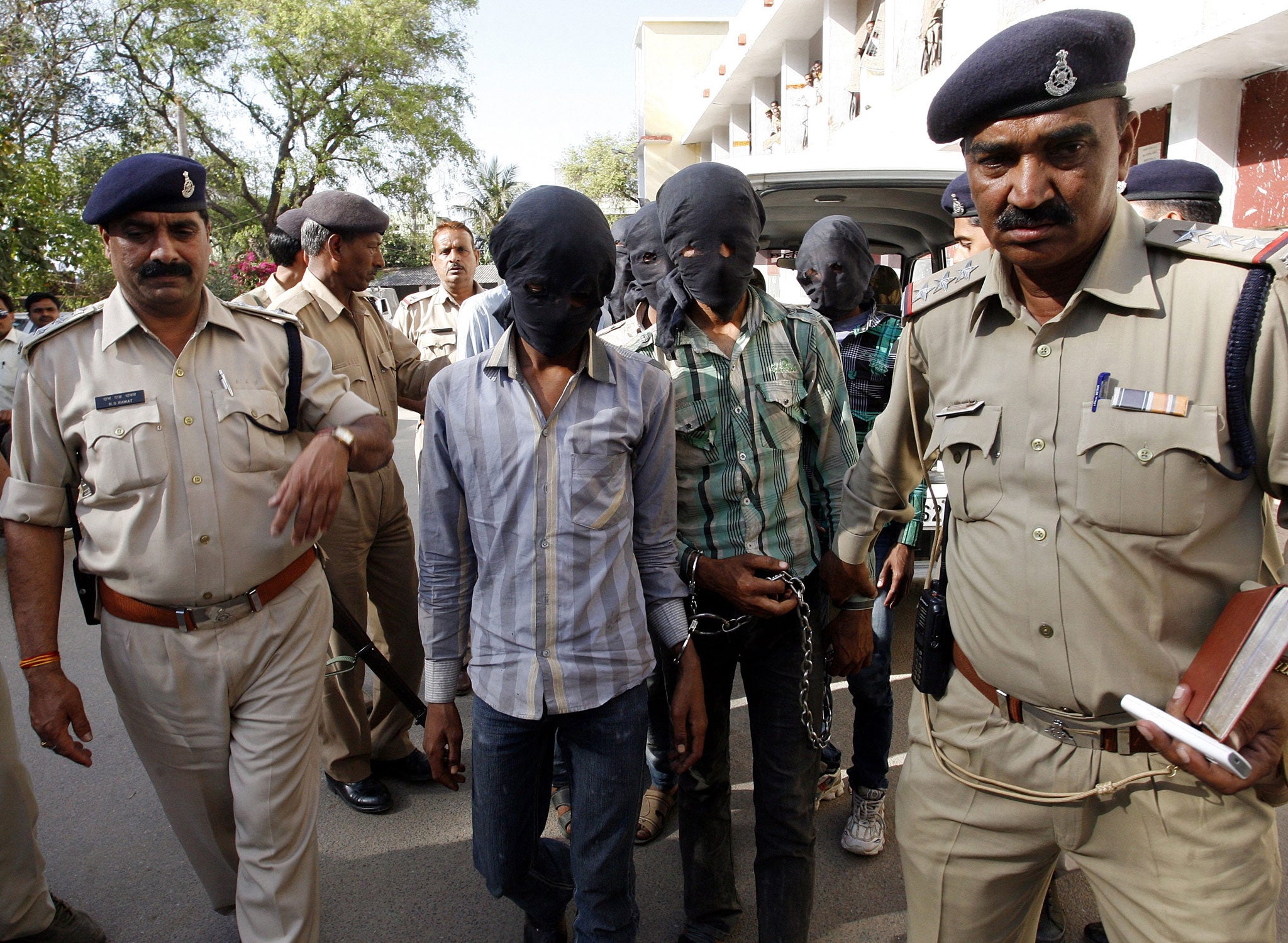Six men accused of the gang-rape of a Swiss tourist who was cycling with her husband in India have appeared in court
