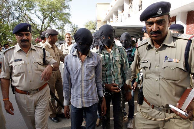 Six men accused of the gang-rape of a Swiss tourist who was cycling with her husband in India have appeared in court