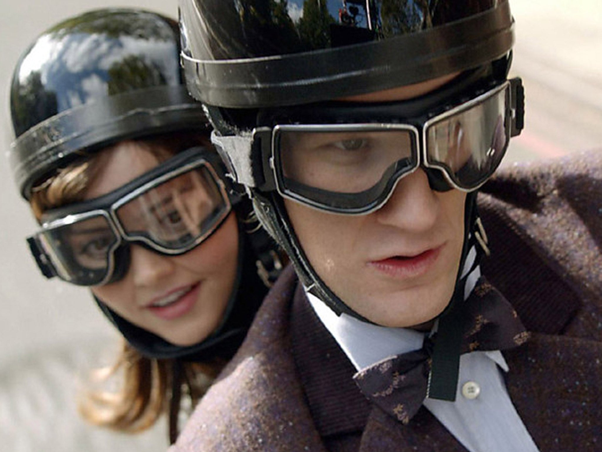 Clara and the Doctor speed through London on a motorbike