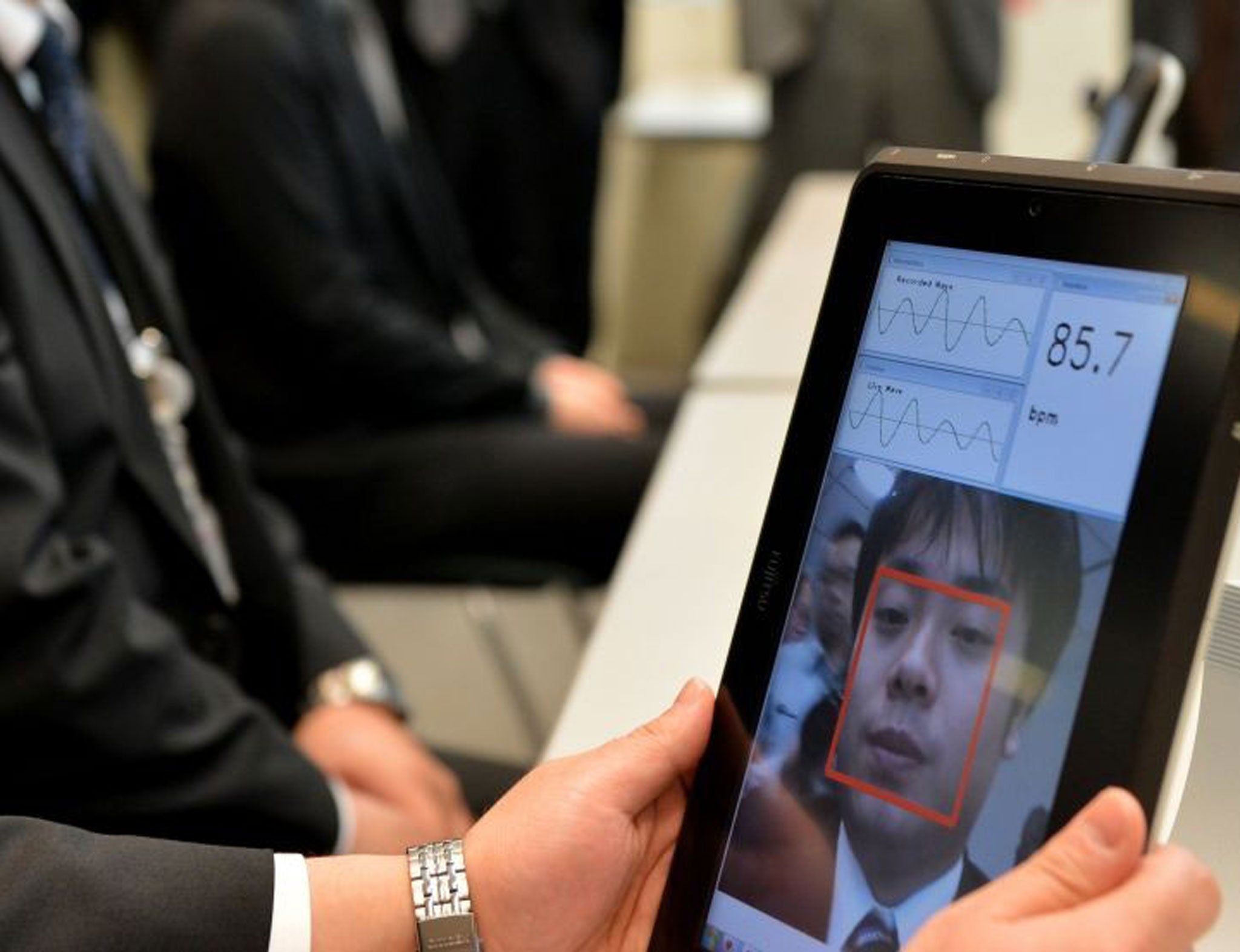 A Fujitsu engineer using the company's new pulse-reading technology
