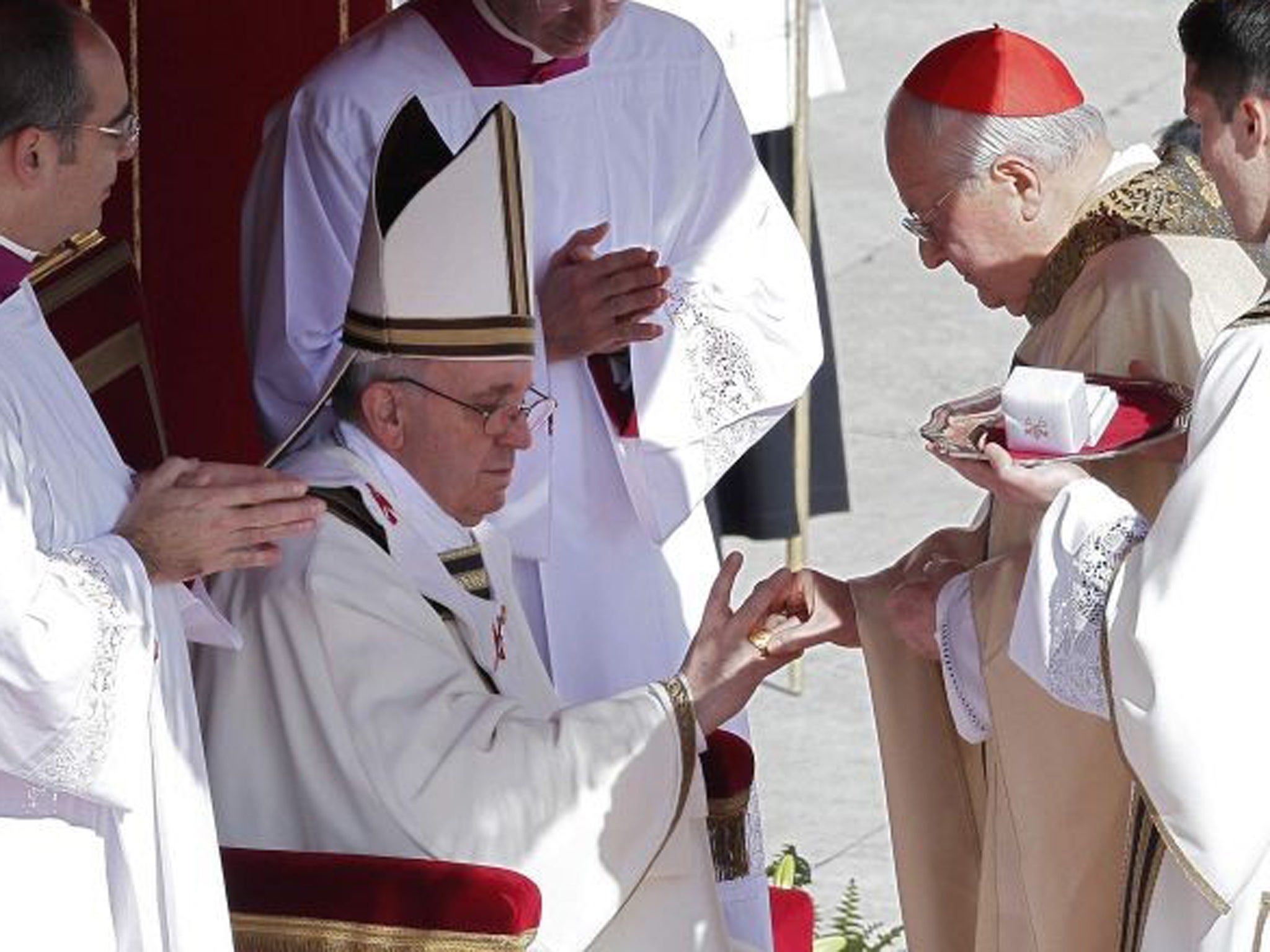 The Fisherman's Ring is placed on the finger of Pope Francis by Cardinal Angelo Sodano, Dean of the College of Cardinals