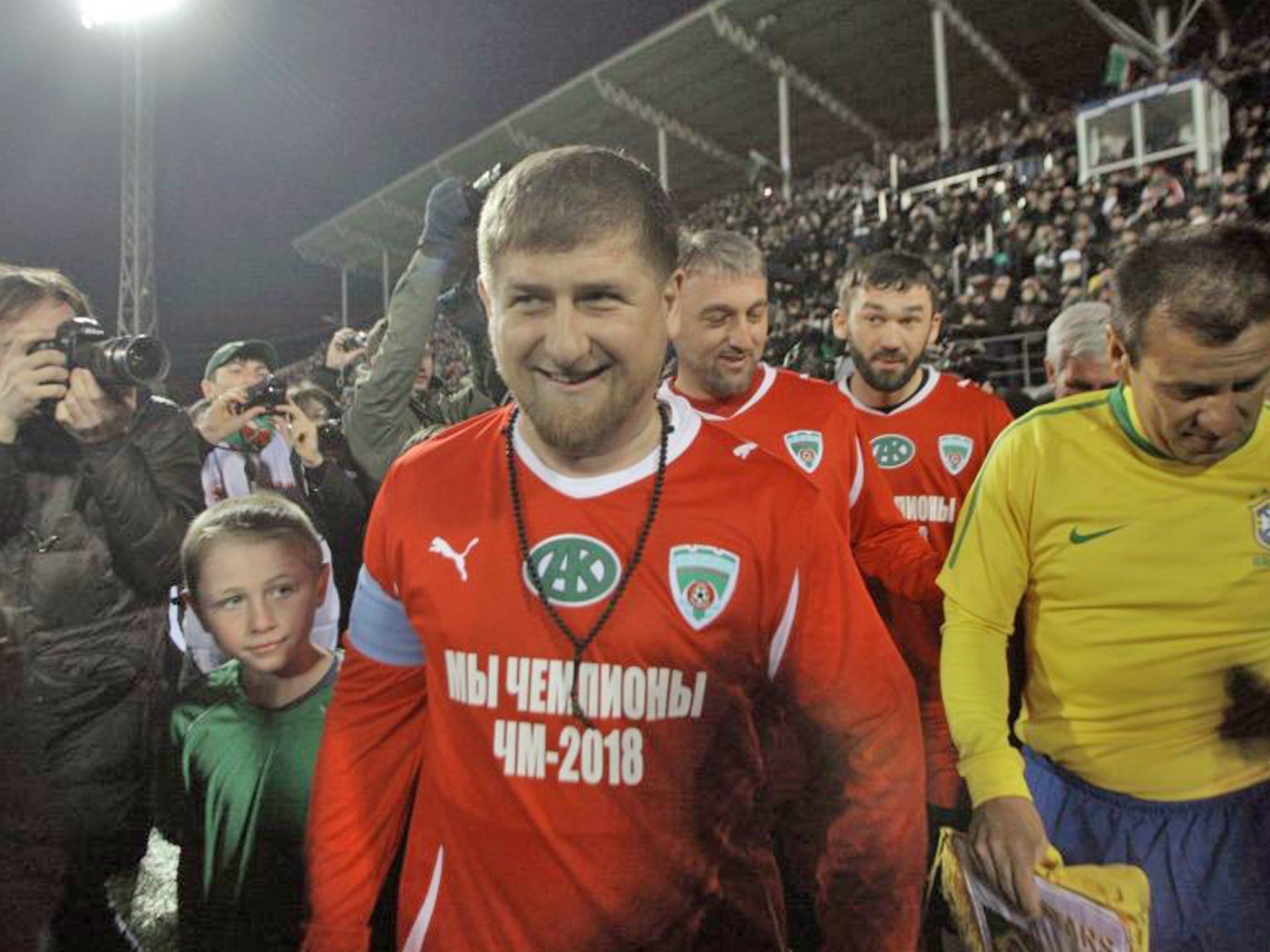 Ramzan Kadyrov, center, seen before a friendly game between Chechnya and Brazil in the stadium in Grozny
