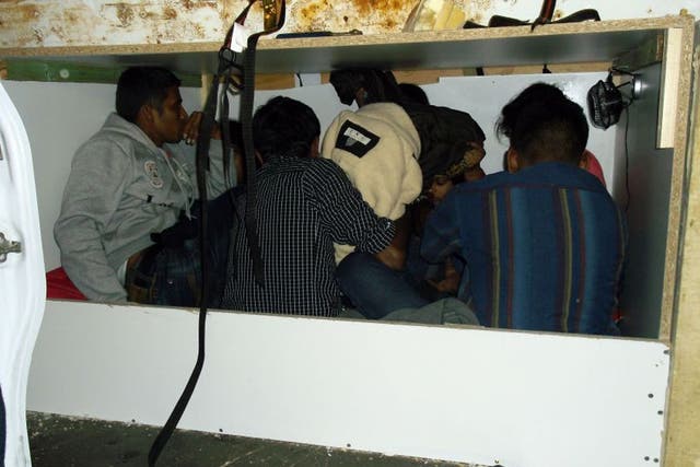 A photograph issued by the UK Border Agency of seven stowaways who were stopped from entering Britain after being found in a tiny purpose-built hideaway inside a van at the Port of Calais