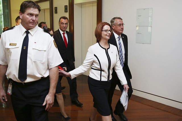 Julia Gillard remains Australia's prime minister after she threw her job open to a leadership ballot but no one was willing to run against her