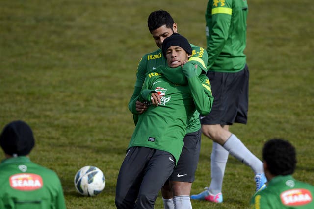 Brazilian national football team forward Hulk (up) plays with Brazilian forward Neymar