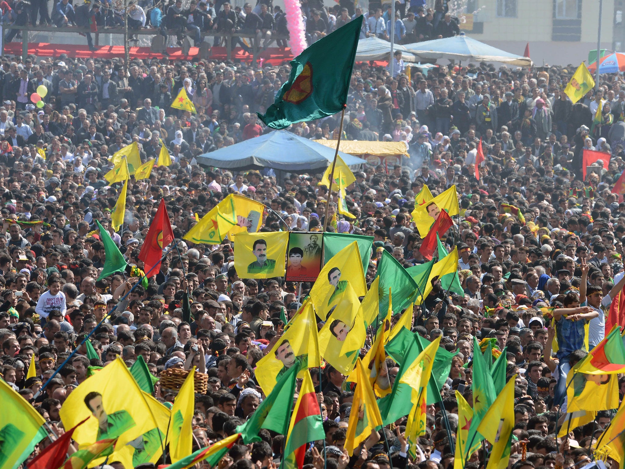 Thousands of PKK wave images of jailed Kurdish rebel leader Abdullah Ocalan in the southeastern Turkish city of Diyarbakir today