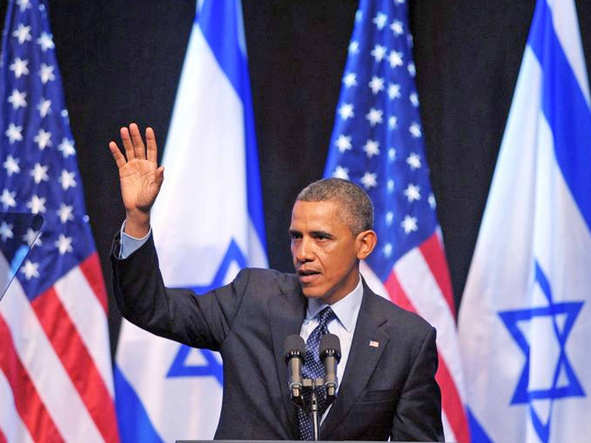 US President Barack Obama waves after delivering a speech to the Israeli people at the Jerusalem International Convention Center in Jerusalem