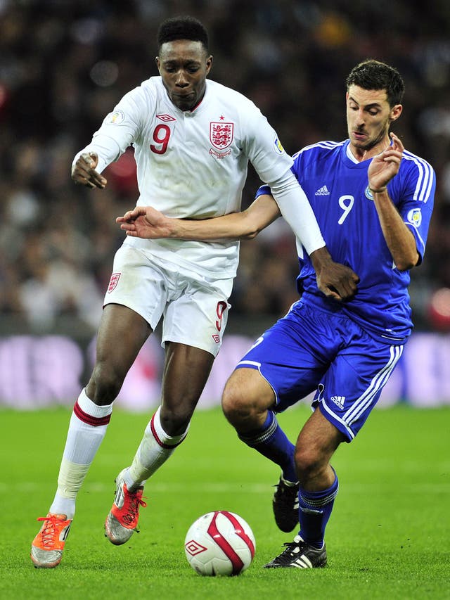 San Marino’s Michele Cervellini, a full-time student, tangles with England’s Danny Welbeck at Wembley last year
