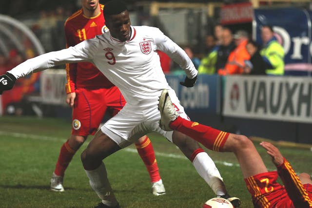 Zaha, who opened the scoring for England, steals the ball 
