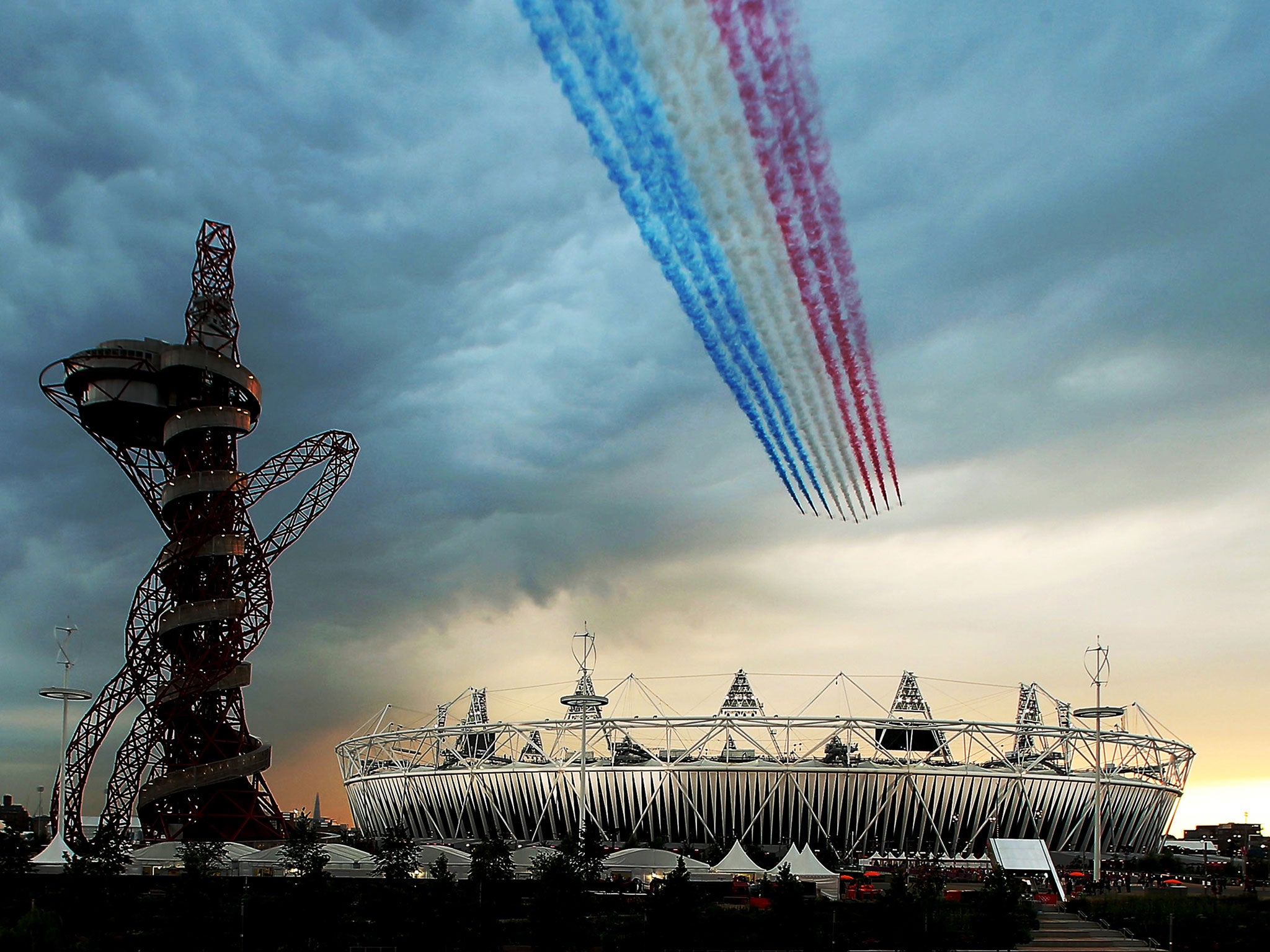 The Red Arrows fly over Olympic Stadium during the Opening Ceremony for the 2012 Summer Olympic Games