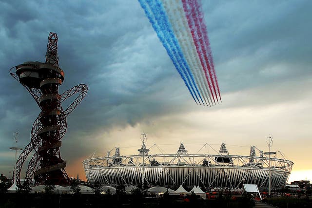 The Red Arrows fly over Olympic Stadium during the Opening Ceremony for the 2012 Summer Olympic Games