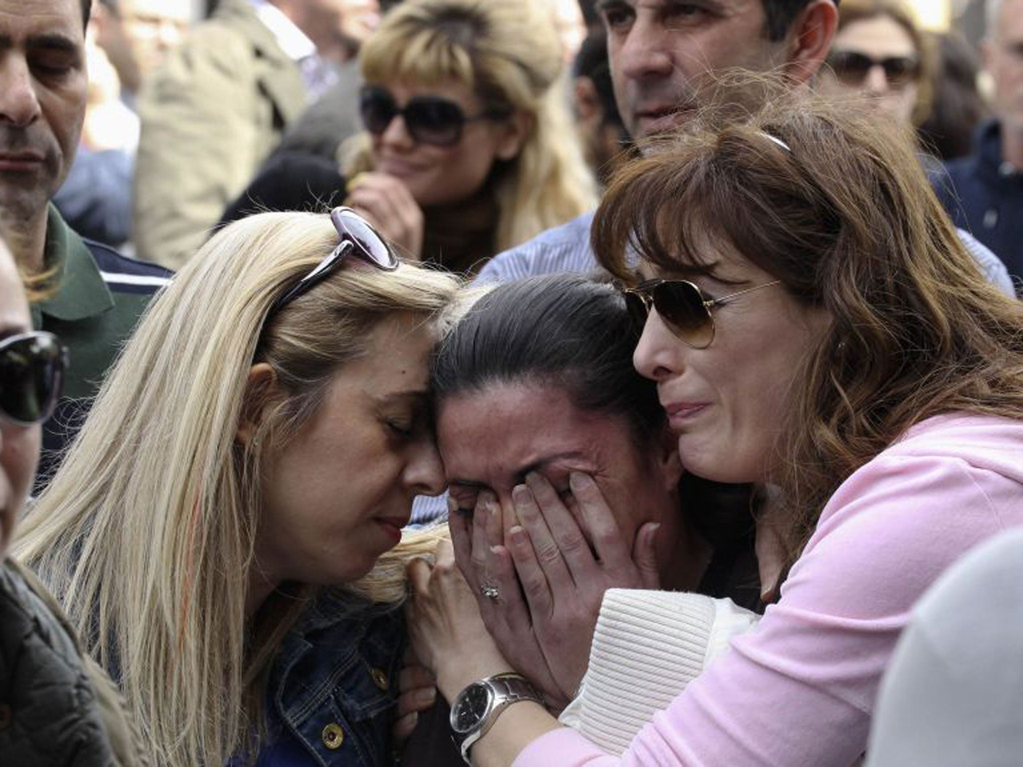 A protester cries at an anti-bailout rally by Cyprus Popular Bank staff