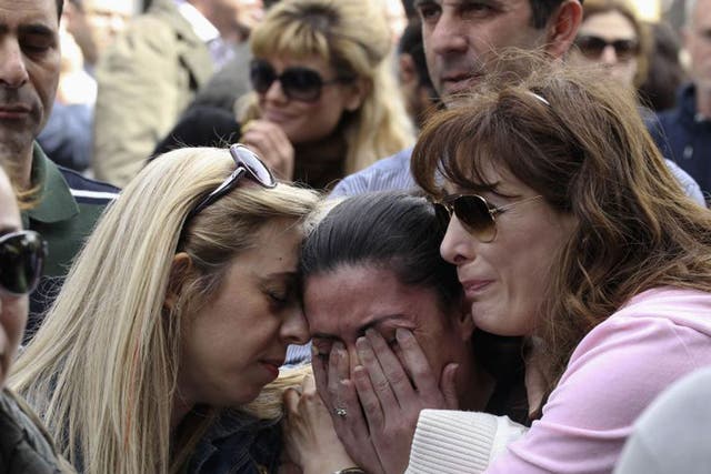 A protester cries at an anti-bailout rally by Cyprus Popular Bank staff 