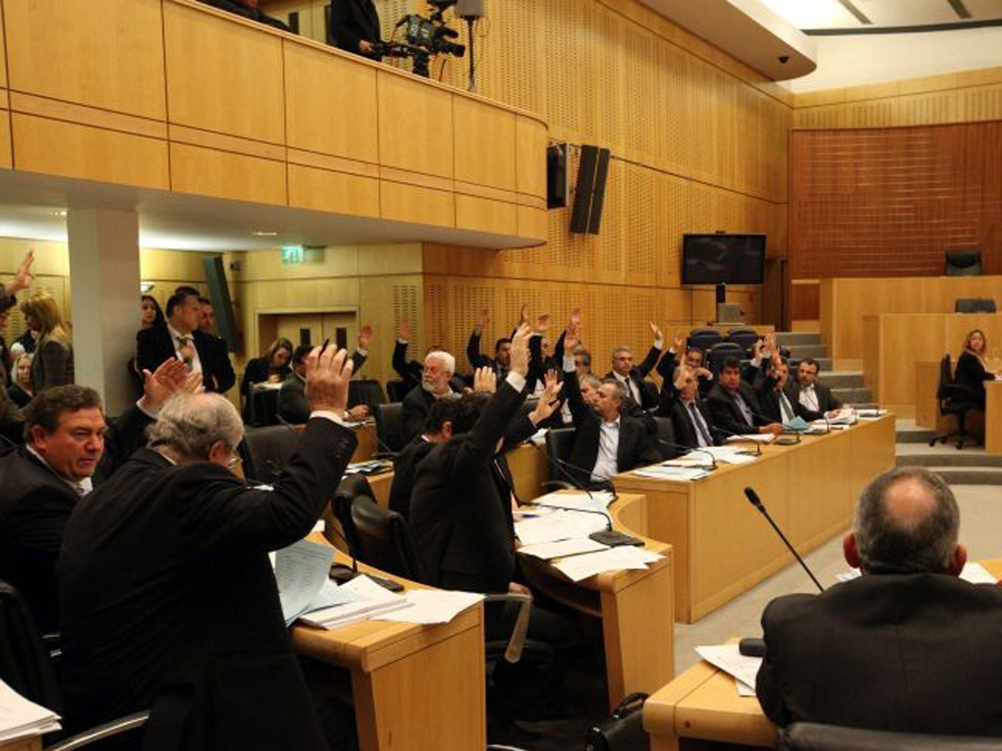 MPs have approve three key bills aiming to secure a broader bailout package and stave off imminent bankruptcy