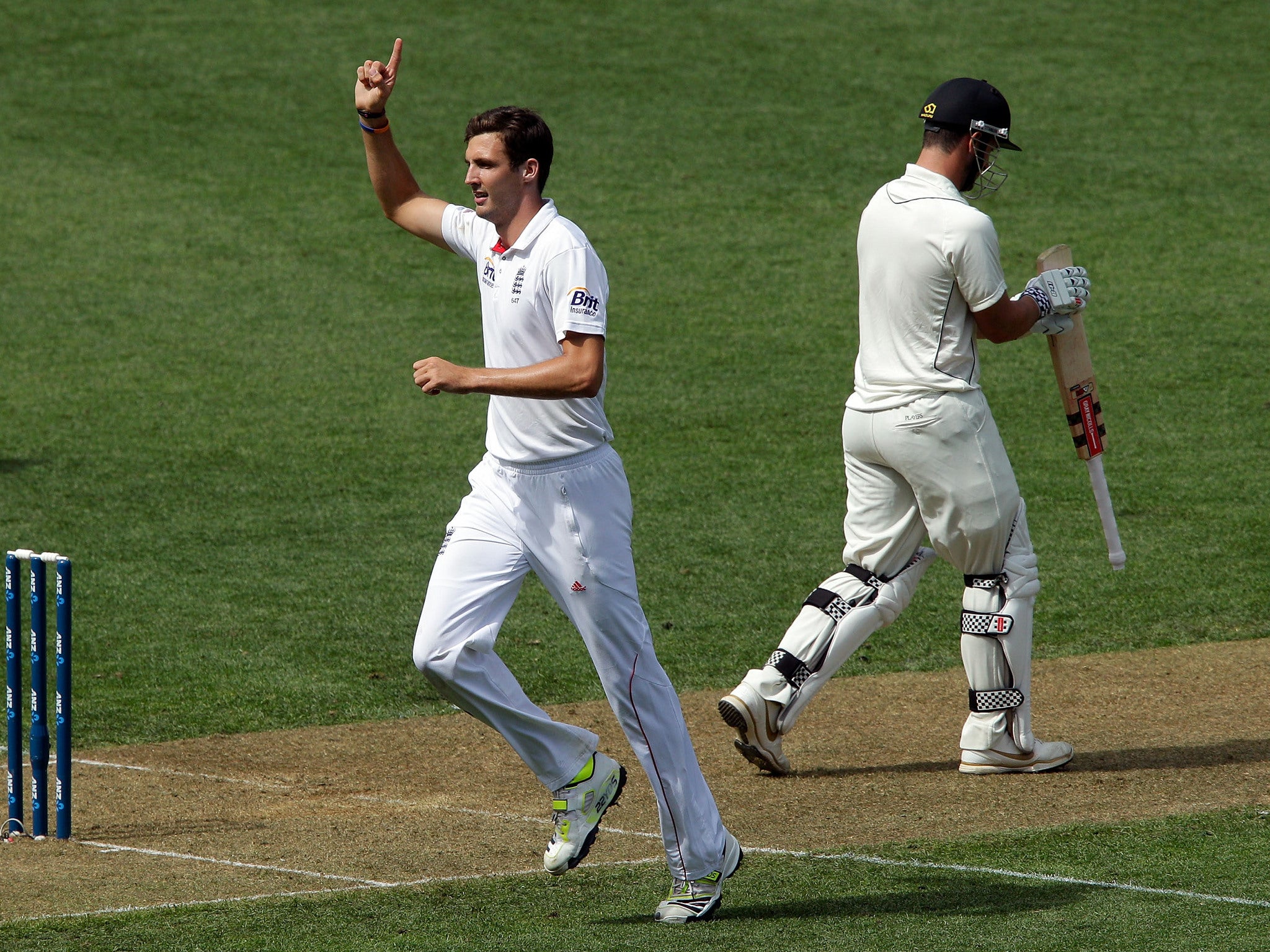 Steven Finn of England celebrates after dismissing Hamish Rutherford of New Zealand during day one of the Third Test match