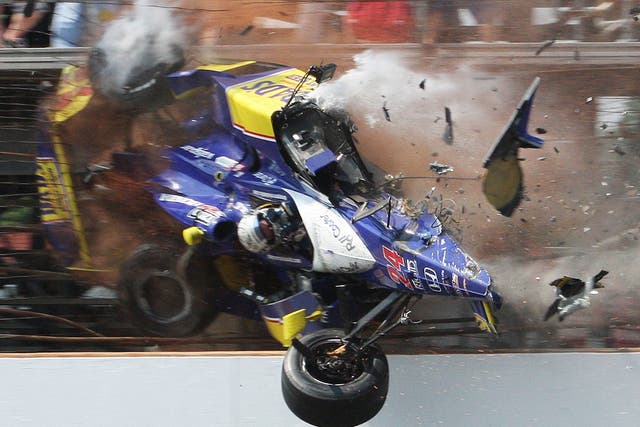 Flying finish: Mike Conway smashes into the fence on the last lap of the Indy 500 in 2010; he crashed again at the same place last year