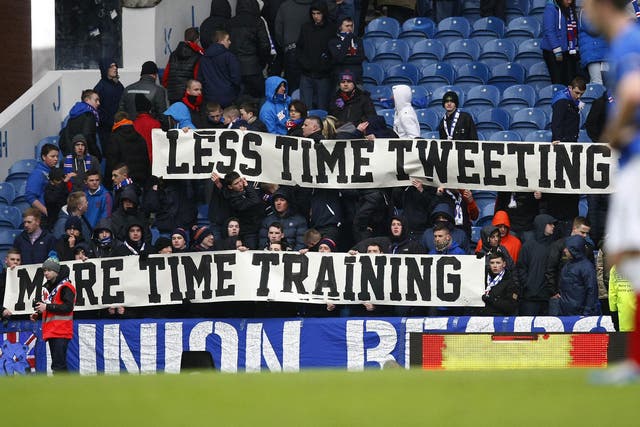 Sign of the times: Rangers fans unveil a banner reacting to poor recent form