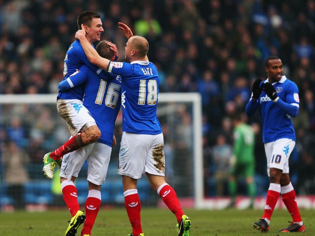 Chimes up: Jed Wallace (in the air) celebrates his goal