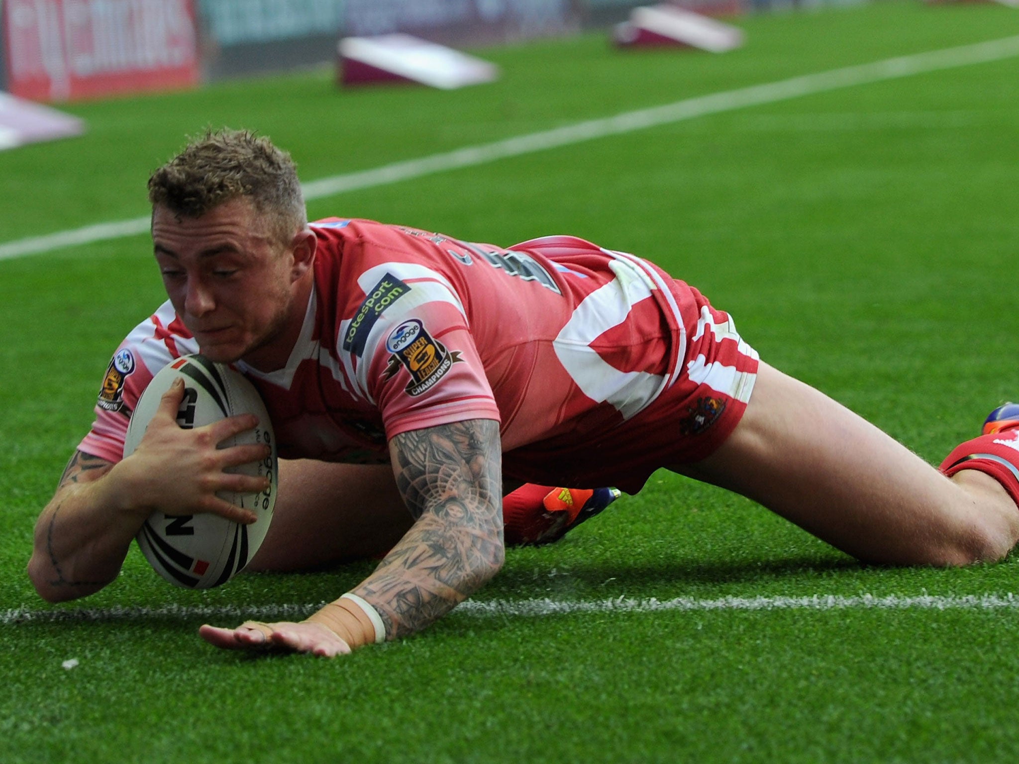 Flat out: The unstoppable Josh Charnley scored four tries for Wigan