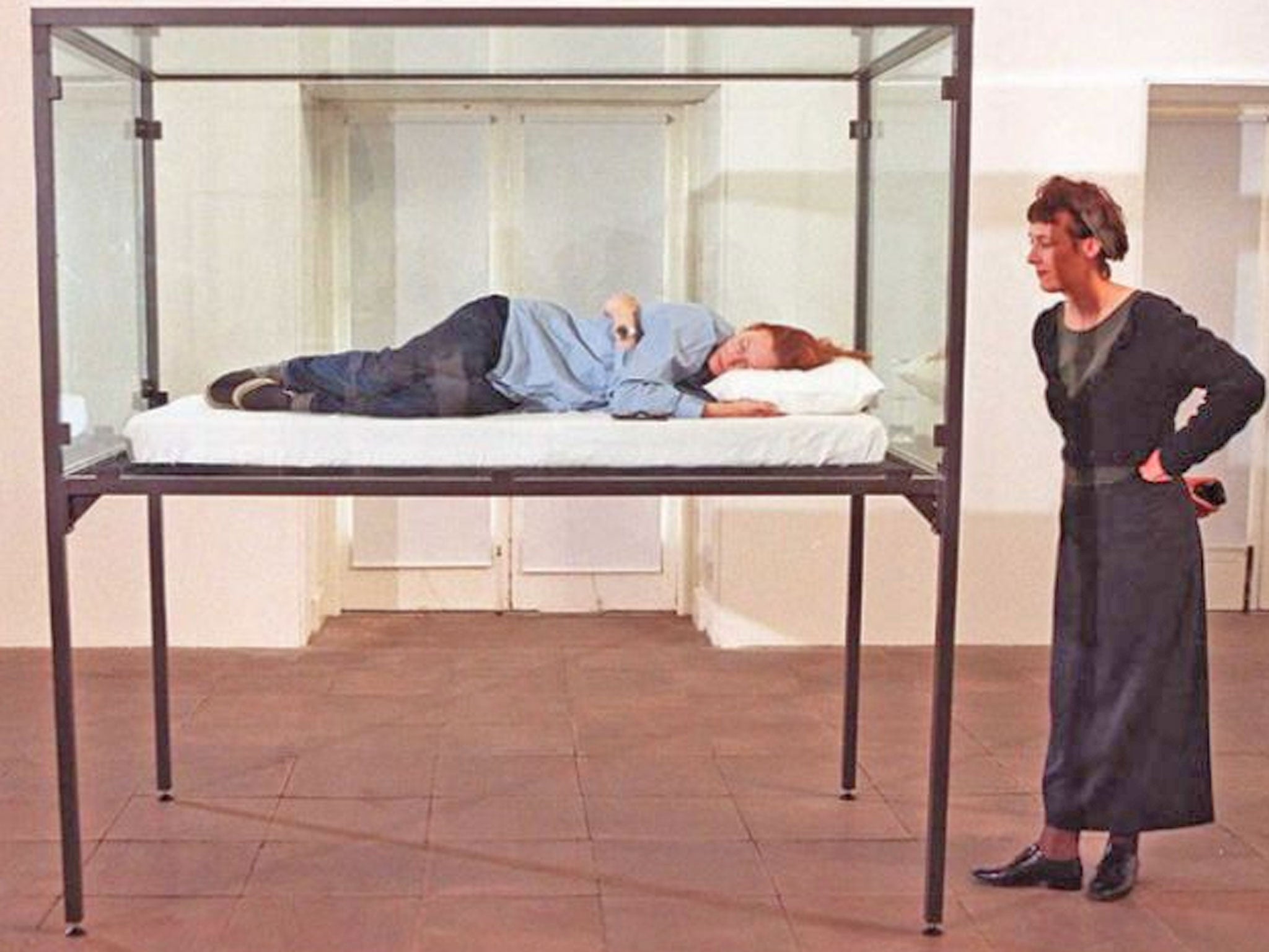 Tilda Swinton, artist and actress, sleeps in a glass box as part of an exhibition called "The Maybe" at the Serpentine Gallery in 1995