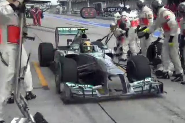 Lewis Hamilton inadvertantly pulls into the McLaren pit