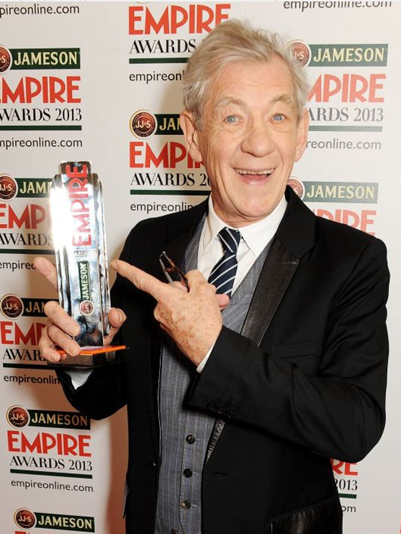 Sir Ian McKellen poses in the press room with the Best Science Fiction/Fantasy award for 'The Hobbit' at the Jameson Empire Awards 2013 at The Grosvenor House Hotel