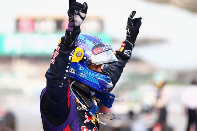 Sebastian Vettel celebrates his controversial victory in Malaysia