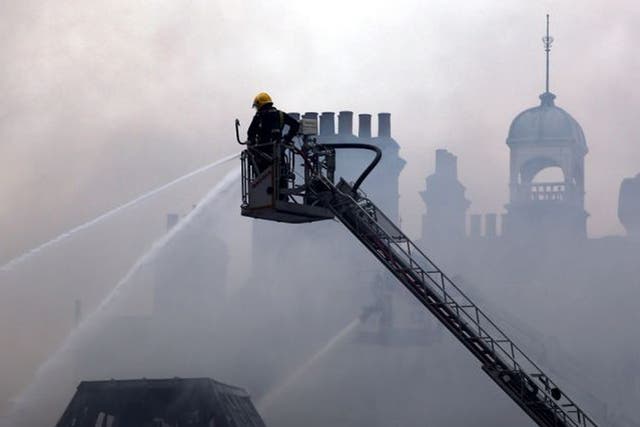 Firefighters attend the blaze at at the Newington Library on Walworth Road, Southwark